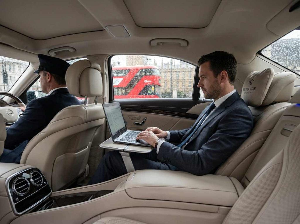 Business executive using a chauffeur service for meetings in the UK